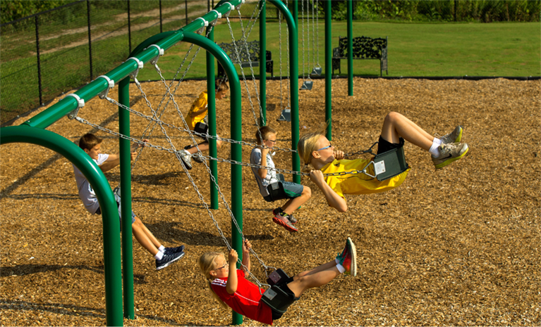 Playground Resources Two children climbing on hills on a playground